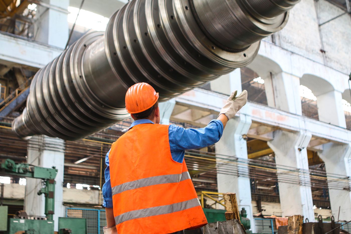 Factory floor with machining equipment being inspected